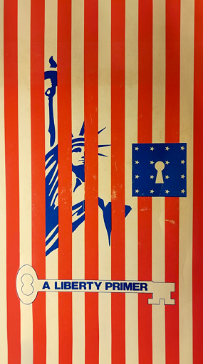 The cover of A Libery Primer, featuring the Statue of Liberty locked behind bars made out of elements of the American flag and the book's title superimposed on a skeleton key.