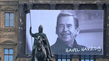 A banner honoring Václav Havel hangs from the National Museum at Wenceslas Square in Prague, with an equestrian statue of Saint Wenceslas in the foreground. (David Sedlecký/Wikimedia Commons)