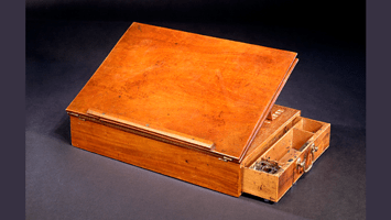 A photograph of the desk used by Thomas Jefferson when writing the Declaration of Independence, and for much of the rest of his life.
