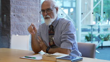 A photo of Eric Mack speaking to employees of the Cato Institute in October 2024.