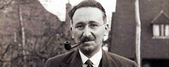 A photo of F.A. Hayek smoking a pipe outside